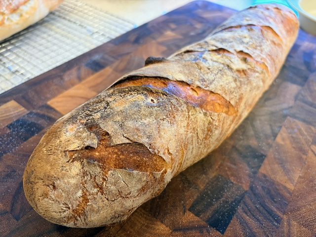 The best looking of the loaves, the one with five slashes.