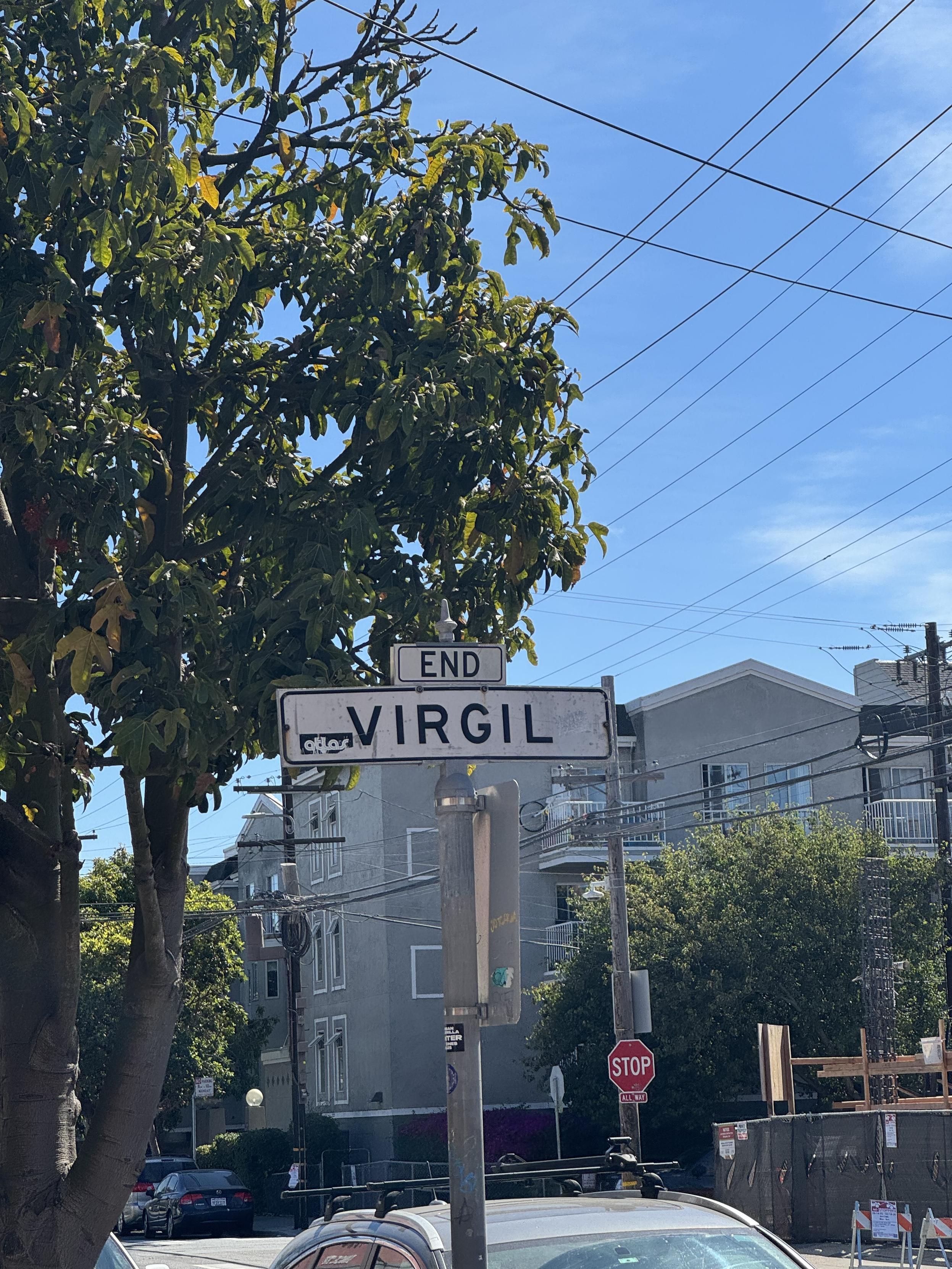 a white street sign in sf marking the end of Virgil street, white with black letters  ENDVIRGIL
